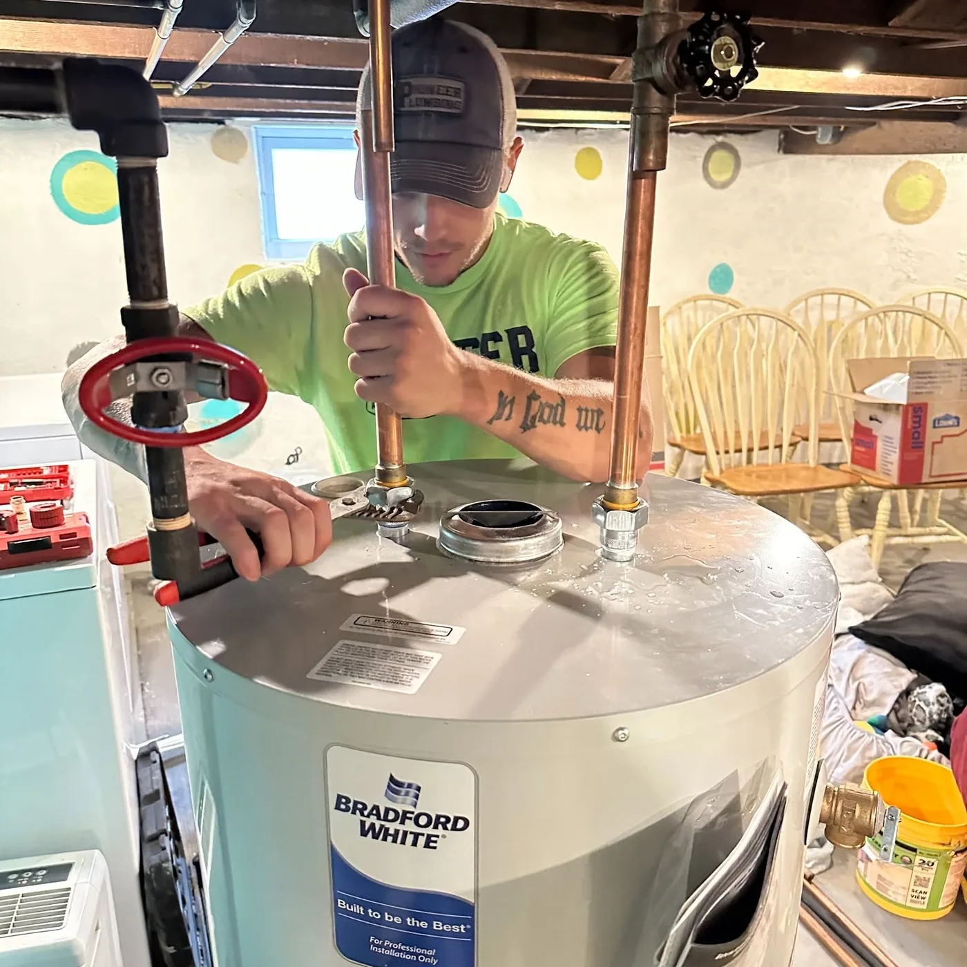 Pioneer technician completing connections at the top of a residential water heater