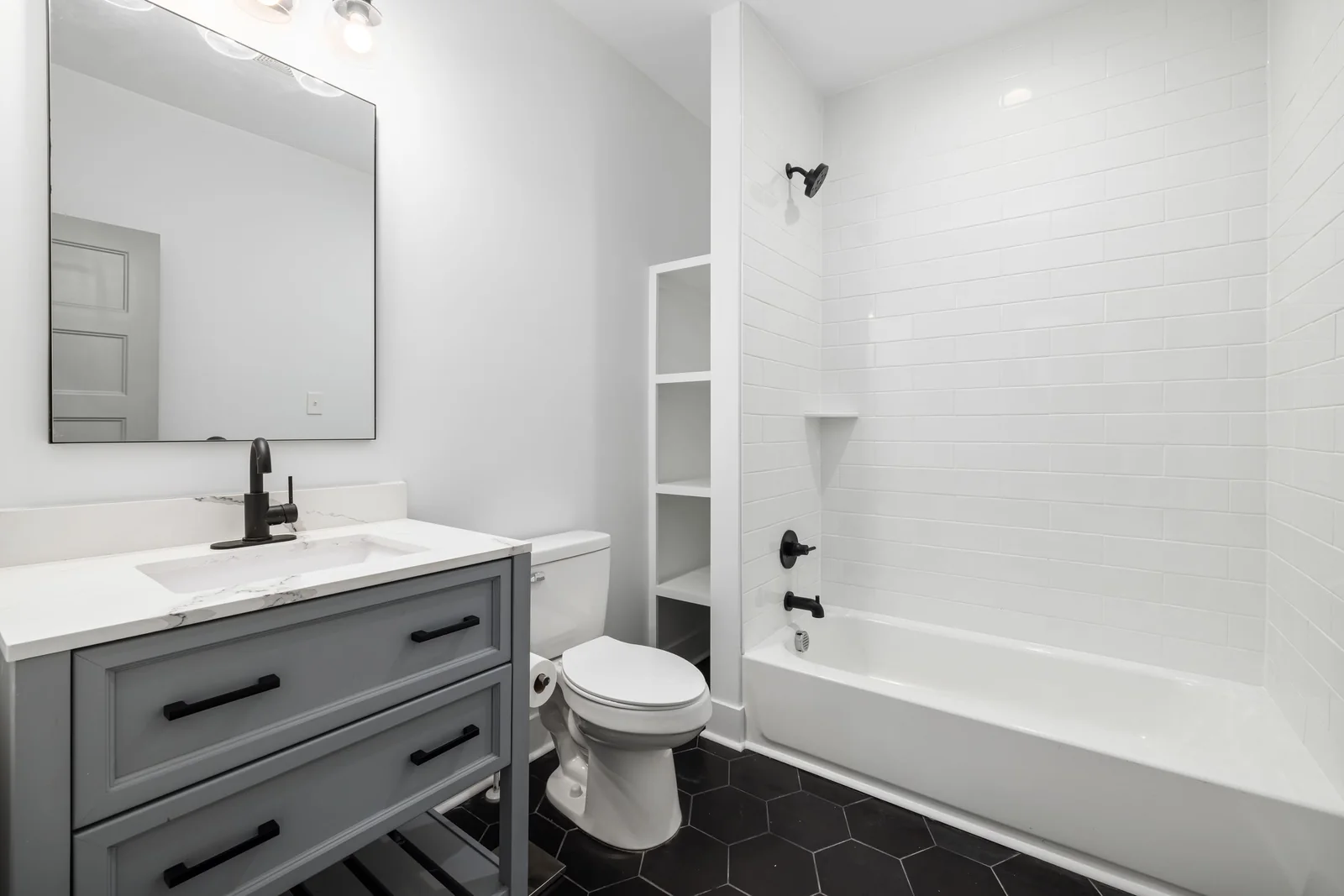Finished bathroom with visible sink and plumbing fixtures